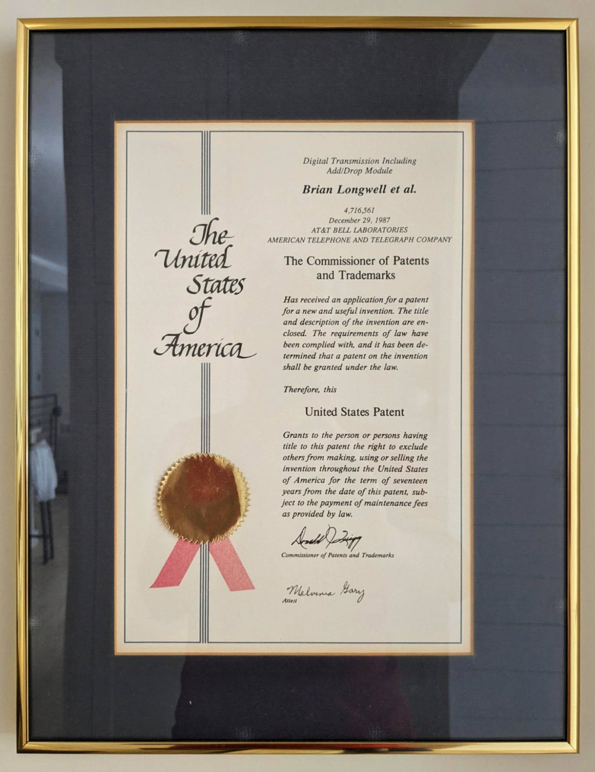 a framed patent award from AT&T Bell Labs for fiber optic communications invention, 1987